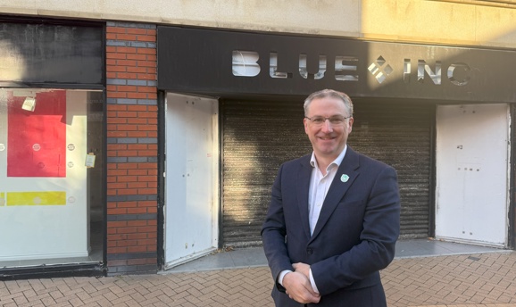 Cllr Matthew Relf on Low Street, Sutton, standing in front of empty shops.